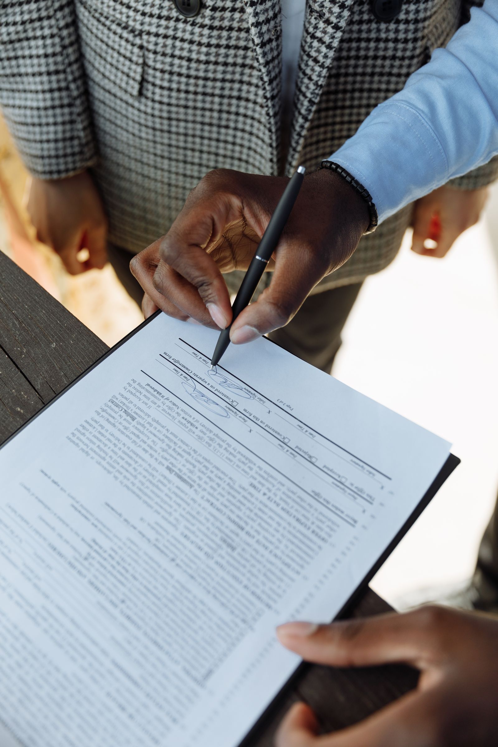 McKinney divorce attorney reviewing documents with client